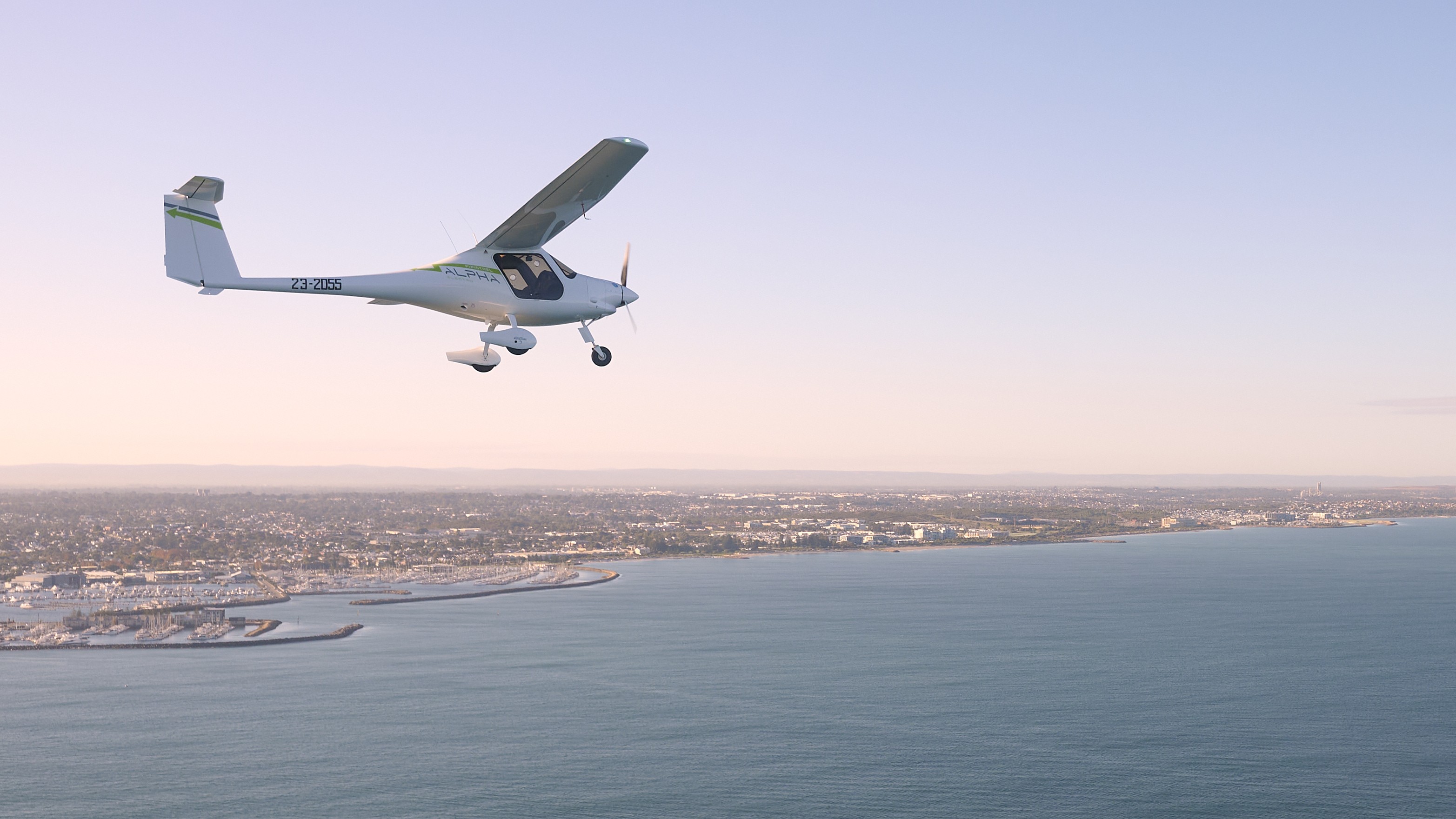 Pipistrel Alpha Electro electric aircraft flying over Fremantle, Western Australia