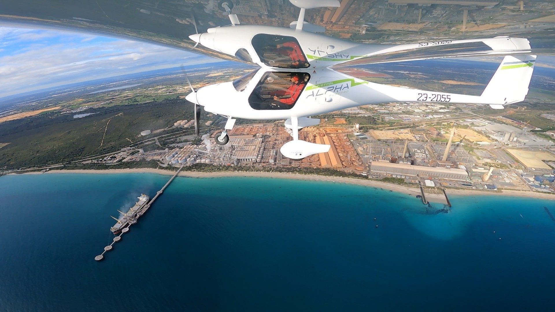 PIpistrel Alpha Electro electric aircraft flying over Kwinana INdustrial area beaches