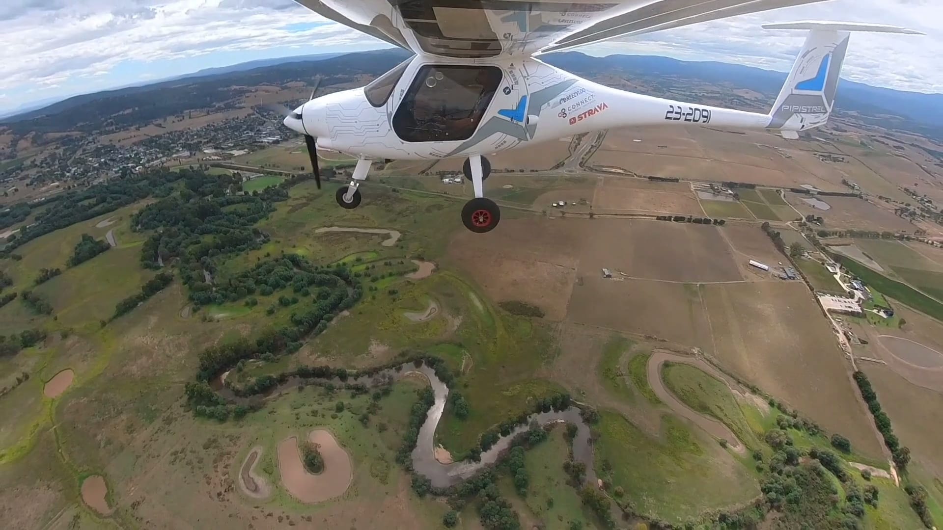 Pipistrel Alpha Electro flying ver the Yarra River in Victoria