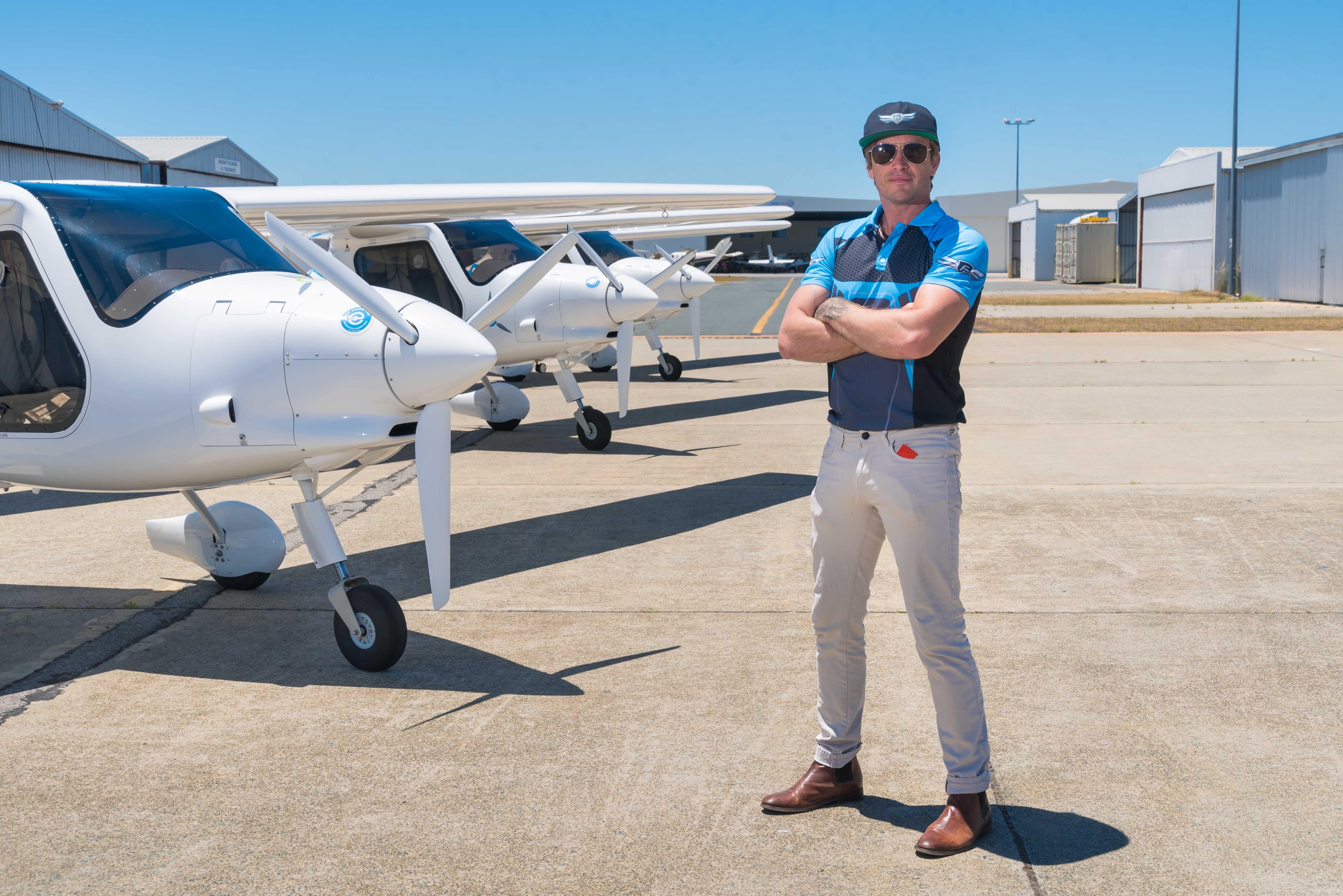 Pipistrel Alpha Electro electric aircraft fleet on the tarmac at Jandakot airport with Founder of FlyOnE Korum Ellis